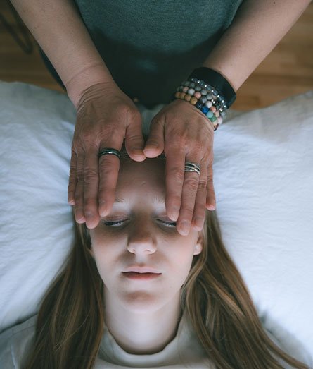 Amanda McCordic casually smiling, at peace with fulfilling her mission of creating a Reiki Marketplace that connects Reiki Practitioners with Reiki Seekers.